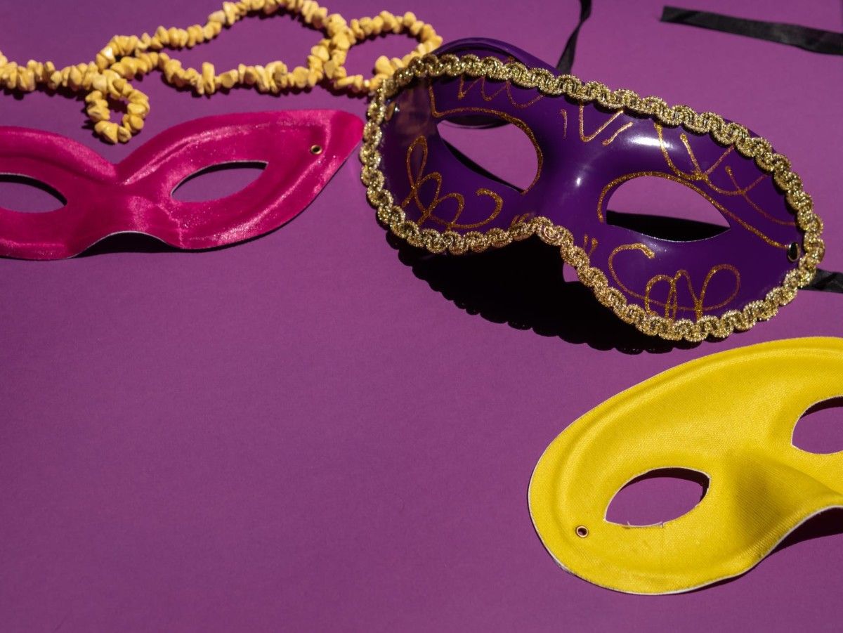 different colored masks on a purple surface